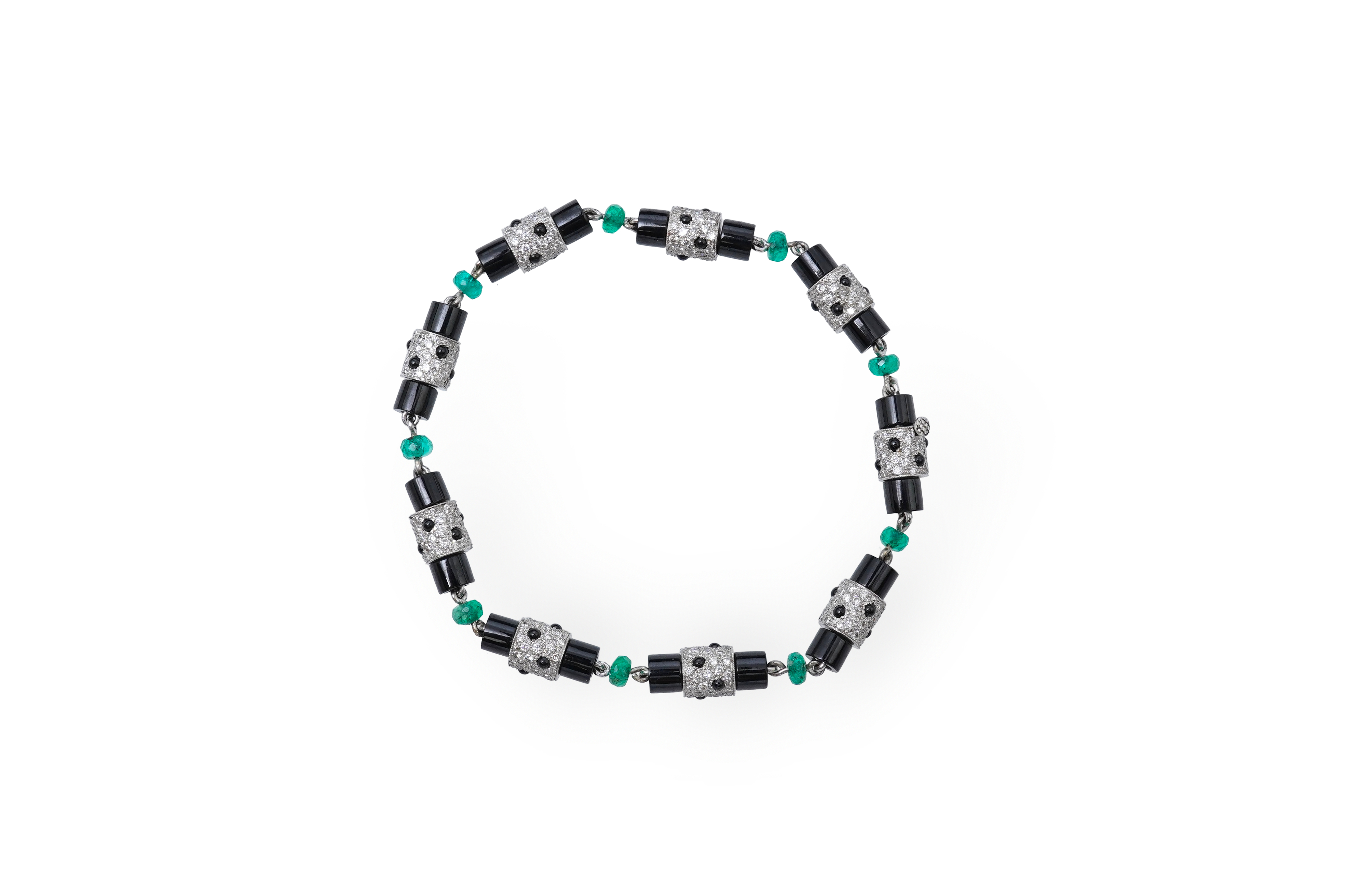 A stylish onyx, emerald and diamond bracelet